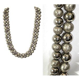 Pewter colored two-strand metal necklace.